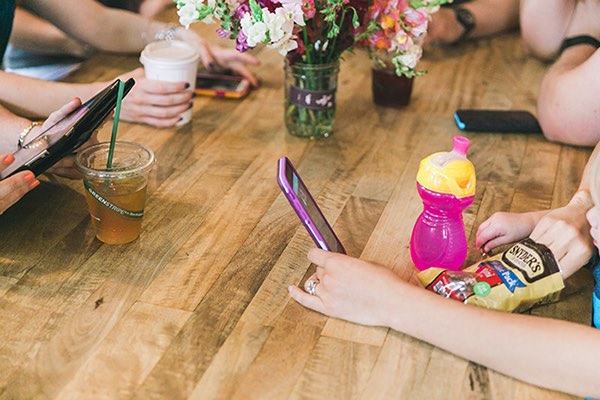 Friends hanging out around a table